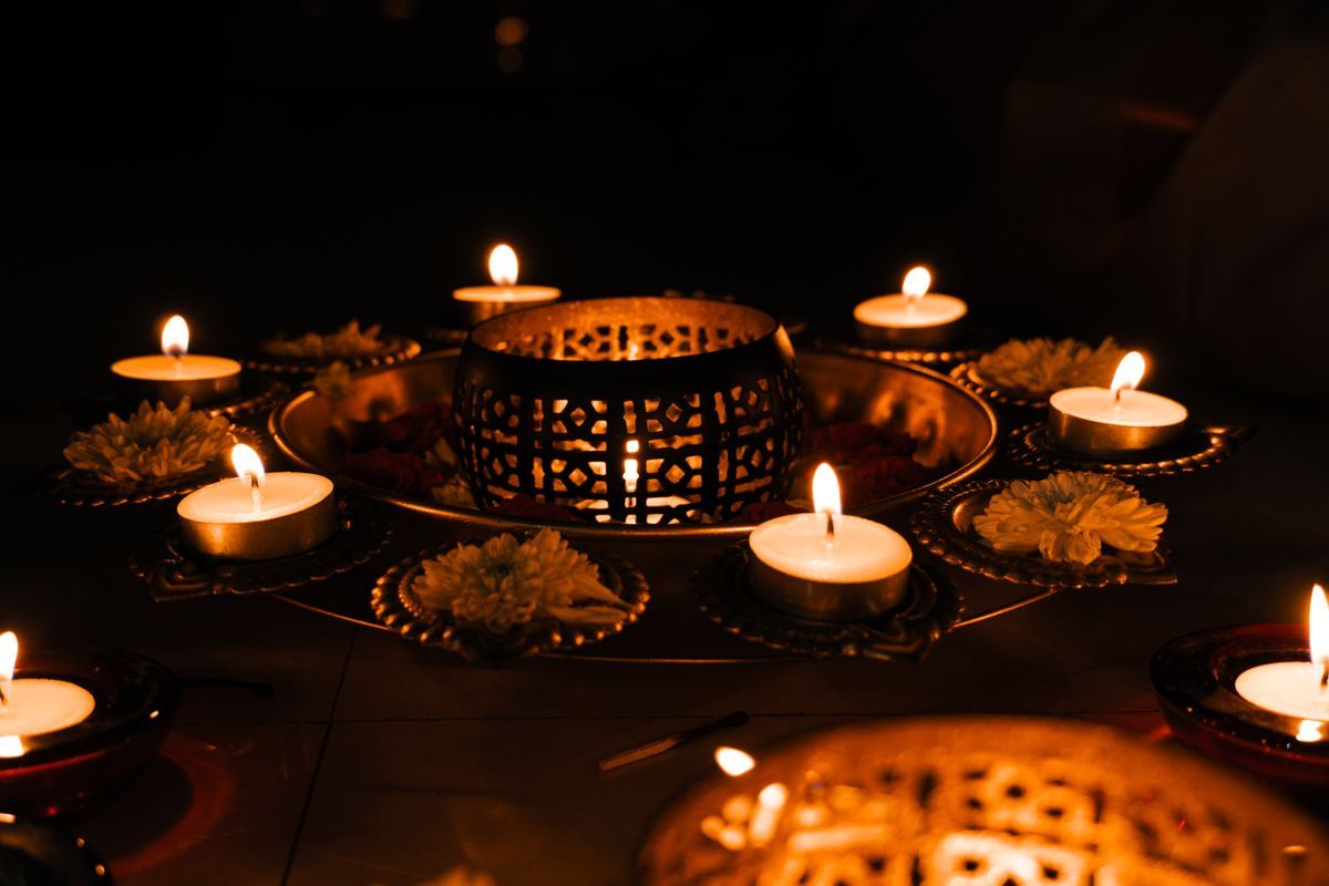 Lit diyas and marigolds for Diwali